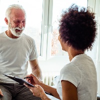 Physiotherapist communicating with patient